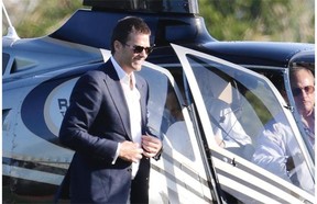 New England Patriots quarterback Tom Brady arrives by helicopter for a speaking event at Salem State University in Salem, Mass., on Thursday.