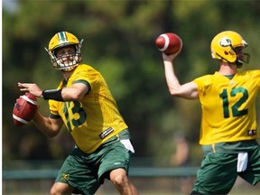 Eskimos quarterbacks Mike Reilly, left, and Justin Goltz set up to throw a pass as they run through drills during the mini-camp at Vero Beach, Fla., on April 19, 2015.