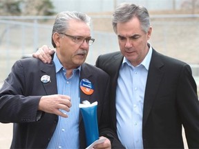 From left, Gene Zwozdesky, Speaker of the legislative assembly, and PC Leader Jim Prentice walk together after Prentice gave a speech on health care at Edmonton’s Whitemud Creek Community Centre on April 14, 2015.