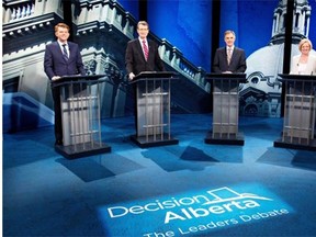 From left Wildrose Party Leader Brian Jean, Liberal Leader David Swann, Alberta Progressive Conservative Leader Jim Prentice and NDP Leader Rachel Notley stand for a photos before leaders debate in Edmonton on Thursday April 23.