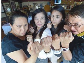 It’s going to be a busy night Saturday at the Palabok House Restaurant in Edmonton where many Filipinos will gather to watch the Manny Pacquiao/Floyd Mayweather fight in Las Vegas. From left, Margarita Mationg, supervisor; Lydia Jimenez, co-owner, her daughter Valerie; and Eddie Gonzales, co-owner, of the Palabok House Restaurant.