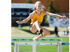 Grace Werner of Strathcona High School clears a hurdle Grace Werner of Strathcona High School clears a hurdle during the Edmonton high school track and field championships at Foote Field on Wednesday.