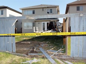 A Jeep Patriot SUV crashed through a fenced backyard of a home located at 4605-154 Avenue and went through the house before stopping in the attached garage on May 11, 2015.