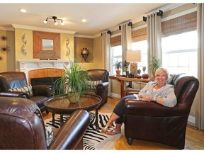 Kimberlee Stewart in the living room of her home, surrounded by her personal design touches.