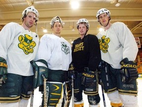 Kris Knoblauch, right, lined up with his fellow graduating teammates on the University of Alberta Golden Bears hockey team in February 2004.