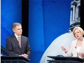 PC Leader Jim Prentice listens to NDP Leader Rachel Notley speak during the leaders’ debate in Edmonton on April 23, 2015.