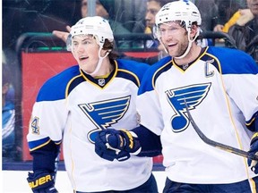 St. Louis Blues forward David Backes, right, celebrates his goal with teammate T.J. Oshie while playing against the Toronto Maple Leafs during NHL action in Toronto on March 25, 2014.