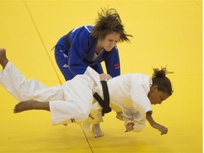 Marti Malloy of the United States throws Rafaela Silva of Brazil to win the gold medal in the under-57 kg class match  during the 2015 Pan-American Judo Championships at Edmonton’s Saville Community Sports Centre on April 25, 2015.