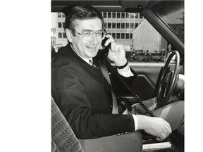 Mayor Laurence Decore with a mobile phone in 1986 when mobile cellular telephone service became available in Edmonton.