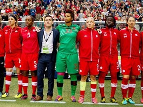 Members of the Canadian women’s soccer team stand prior to a November 2013 match in Vancouver. Second from left is Edmonton’s Selenia Iacchelli
