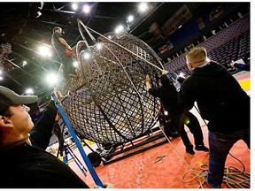 Members of the Shrine Circus assemble the “Globe of Death” to be used for a motorcycle stunt during setup for an Al Shamal Shrine Circus at Rexall Place several years ago in Edmonton. The circus is back in town May 1-3, 2015.