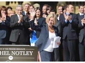 Newly elected NDP MLAs line up in front of Government House to hear Rachel Notley’s speech before their first Caucus meeting on Saturday May 9, 2015.