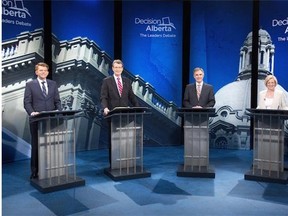 From left Wildrose Party leader Brian Jean, Liberal leader David Swann, Alberta Progressive Conservative leader Jim Prentice and NDP leader Rachel Notley stand for a photo op before leaders debate in Edmonton on Thursday, April 23, 2015.