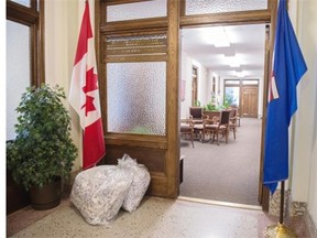 A couple bags of shredded papers lie outside the minister of environment offices. A massive transition in personal will occur .at the Legislature in the coming days as the Conservatives move out to make way for the NDP government.