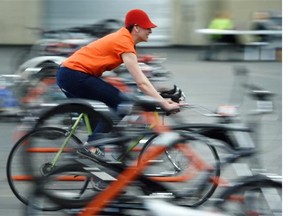 Volunteer Jenna Montgomery sorts bikes at the fourth annual Edmonton Bike Swap at the EXPO Centre on Saturday, May 9, 2015. Bikes are tech-checked by a technician and half the profit raised from the swaps is donated back to the community.