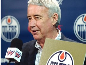 Bob Nicholson, talking to the media about being appointed CEO of the Oilers Entertainment Group Monday, holds the gold card from the 2015 NHL Draft Lottery Draw, at Rexall Place in Edmonton, April 20, 2015.