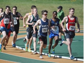 The pack rounds the corner in the senior boys’ 3,000m race during the Edmonton high school track and field championships at Foote Field on Wednesday.