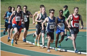 The pack rounds the corner in the senior boys’ 3,000m race during the Edmonton high school track and field championships at Foote Field on Wednesday.