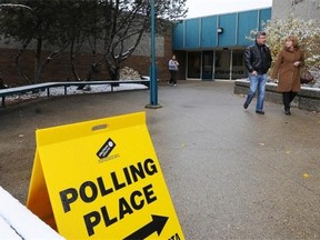 People come out after voting in the Edmonton-Whitemud by-election at Riverbend Jr High school in Edmonton on Monday Oct. 27, 2014.