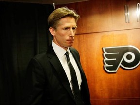 Philadelphia Flyers’ newly hired head coach Dave Hakstol steps down from the stage after speaking at a news conference on May 18, 2015, in Philadelphia.