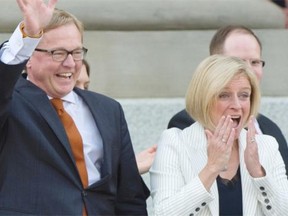 Premier  Rachel Notley and her 11 cabinet ministers are sworn in on the legislature steps in Edmonton on May 24, 2015.