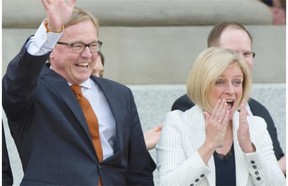 Premier  Rachel Notley and her 11 cabinet ministers are sworn in on the legislature steps in Edmonton on May 24, 2015.