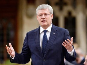 Prime Minister Stephen Harper answers a question during Question Period in the House of Commons on Parliament Hill in Ottawa, Tuesday June 17, 2014 .