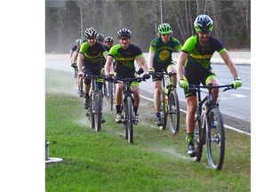 Riders from a bike club head down Fox Drive on an outing in Edmonton on April 23, 2015.