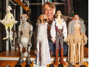 Ronnie Burkett poses for a photo with some of his marionette characters in fall of 2014.