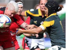 Canada's Jen Kish carries hard against South Africa at the London Women's Sevens.