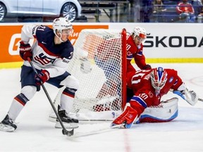Team USA’s Dylan Larkin, left, tries to score against Norway goaltender Lars Haugen during a world hockey championship Group B match at CEZ Arena in Ostrava, Czech Republic, on May 2, 2015.