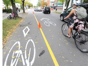 A temporary bikeway along 83rd Avenue: in the latest flare-up between bike lanes and street parking, Edmonton business owners want the city to remove a bicycle lane on 97th Street, saying it has hurt their businesses.