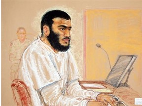In this photo of a sketch by courtroom artist Janet Hamlin, reviewed by the U.S. Military, Canadian defendant Omar Khadr sits during a hearing at the U.S. Military Commissions court for war crimes, at the U.S. Naval Base, in Guantanamo Bay, Cuba, Jan. 19, 2009.