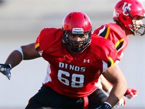 University of Calgary Dinos offensive lineman Sukh Chungh is shown in action in a Canada West University Athletic Association football game against the Regina Rams on Sept. 1, 2012.