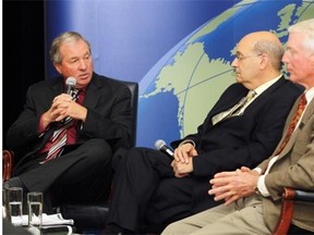 University of Calgary professor Jack Mintz is flanked by former Alberta finance ministers Ron Liepert, left, and Ted Morton, right, at a U of C School of Public Policy debate at the Fairmont Palliser in Calgary in this Sept. 24, 2013 file photo.