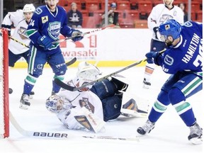 Utica Comets forward Wacey Hamilton scores on Oklahoma City Barons goalie Richard Bachman during Game 5 of their American Hockey League Western Conference semifinal on Thursday, May 14, 2015, at the Cox Convention Center in Oklahoma City. The Comets won the game 3-1 to take a three games to two series lead.