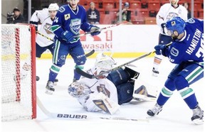 Utica Comets forward Wacey Hamilton scores on Oklahoma City Barons goalie Richard Bachman during Game 5 of their American Hockey League Western Conference semifinal on Thursday, May 14, 2015, at the Cox Convention Center in Oklahoma City. The Comets won the game 3-1 to take a three games to two series lead.