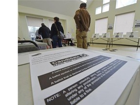 Voters cast their votes at the advance poll at McKernan Community Hall in Edmonton on Wednesday April 29, 2015.
