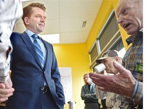 Wildrose Leader Brian Jean talks to supporters as he makes a stop at candidate Sharon Smith’s campaign office in Leduc, May 4, 2015.