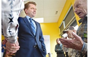 Wildrose Leader Brian Jean talks to supporters as he makes a stop at candidate Sharon Smith’s campaign office in Leduc, May 4, 2015.