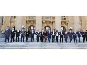 Wildrose Party Leader Brian Jean, middle, and members of his caucus walk down the front steps of the Alberta Legislature on May 11, 2015.