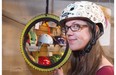 Buy your athletic mother a colourful helmet to protect her noggin. Here, Kim Snider tries on a Nutcase helmet at Redbike in Garneau.