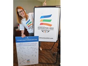 Aileen Giesbrecht, executive director of the Edmonton bid team, shows off paraphernalia from the city’s 2022 Commonwealth Games bid, which was called off in February.