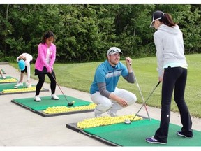 Assistant pro Adam Bruce gives junior golfers tips on driving during a CN Future Links girls’ clinic at the Glendale Golf & Country Club in Edmonton, one of many development programs for children in Alberta. Junior golf is seeing unprecedented growth in the province.