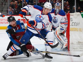 Keith Aulie clears the crease of unwanted pests, and the puck from danger.