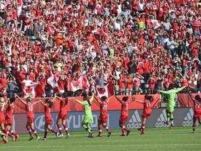 Canada celebrates with the fans after defeating China 1-0 in FIFA Women’s World Cup action at Commonwealth Stadium in Edmonton, June 6, 2015.