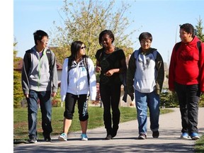 Captain Nichola Goddard School students, from left to right, Bryant Woo, Lily Huang, Juliet Omini, Immad Manzoor and Max Hernandez walk to school. The school has been nominated for its green commuting program which encourages students to find alternative transportation to school.