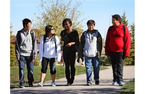 Captain Nichola Goddard School students, from left to right, Bryant Woo, Lily Huang, Juliet Omini, Immad Manzoor and Max Hernandez walk to school. The school has been nominated for its green commuting program which encourages students to find alternative transportation to school.