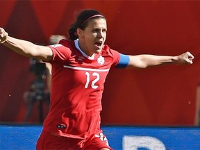 Christine Sinclair celebrates after scoring on a penalty kick in extra time to give Canada a 1-0 win over China to open the FIFA Women’s World Cup at Commonwealth Stadium on June 6, 2015.