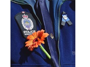 Churches organized a prayer walk Friday in the neighbourhood where Const. Daniel Woodall was shot and killed Monday.